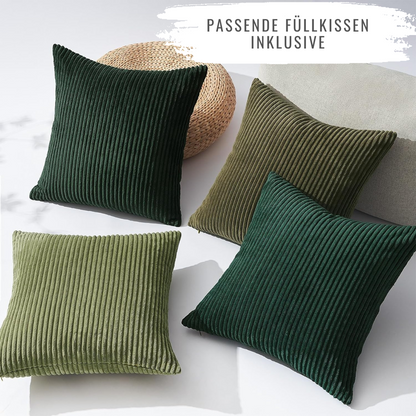 4er Set Oeko-Tex Kissen mit bequemer Polyesterfüllung für Sofa und Bett von Interior by Hakito - grüne und beige Kissen auf einer hellen Oberfläche.