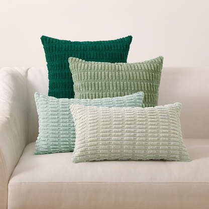 Stylisches 4er Set Kissen Mosa Kordsamt von Interior by Hakito in frischen Grüntönen, ideal für Ihr Sofa.