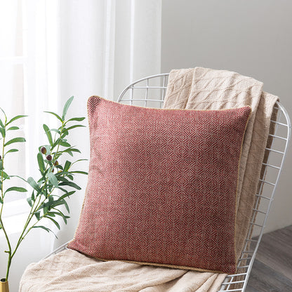 Ein rotes Kissen aus dem Orientalischen Kissen-Set Paks von Interior by Hakito, dekorativ auf einem Stuhl drapiert, ideal für orientalisches Flair.