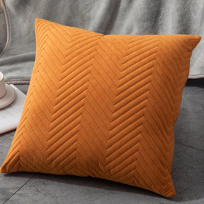 Kissen Rolf von Interior by Hakito, leuchtend orangefarbenes Kissen mit elegantem Fischgrätenmuster, ideal für jedes Zuhause.